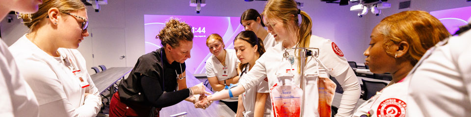 Students participate in a demostration in the simulation lab.