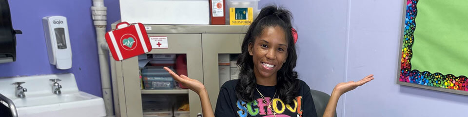 A school nurse poses for a photo in her office.