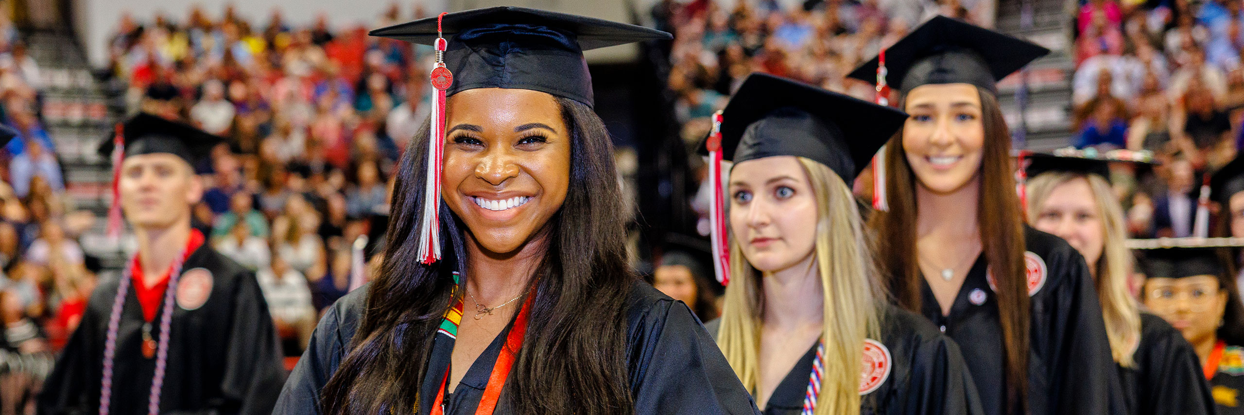 Graduates walking in the commencement ceremony