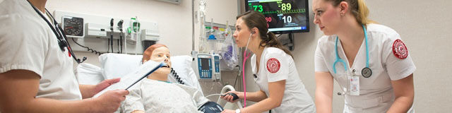 Group of students practicing in the Sim Lab